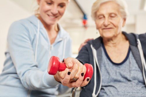 Two Women Lifting Weights