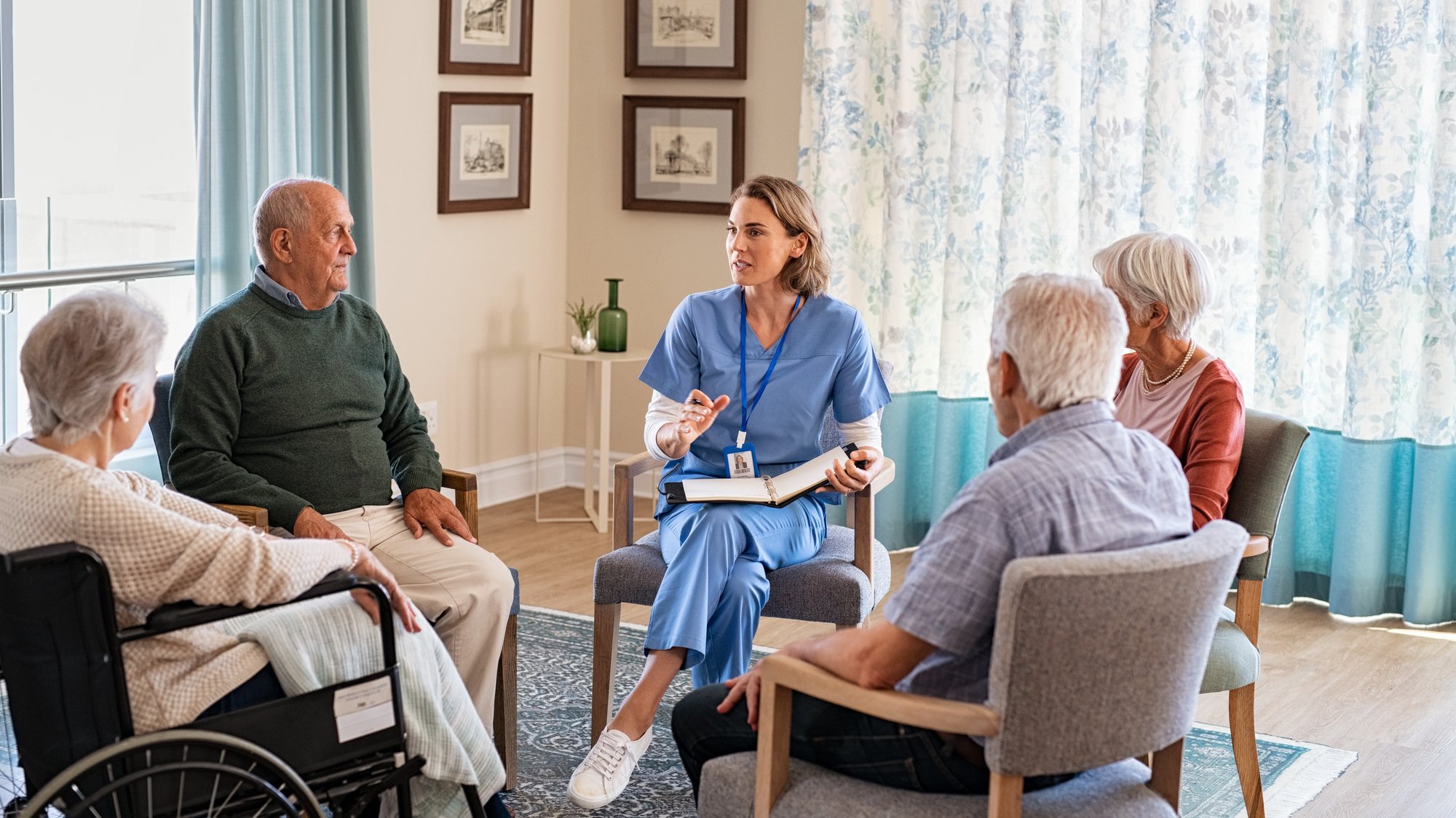 nurse-talking-to-senior-people-during-group-therap-2023-11-27-05-16-44-utc