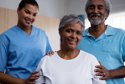 Two Nurses With Elderly Woman